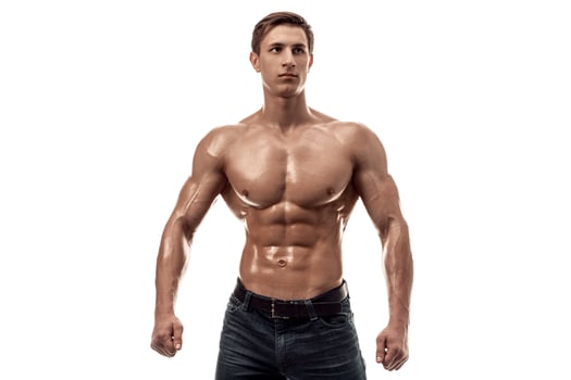Muscular handsome young man with naked torso. Isolated on white background. Copy space photo