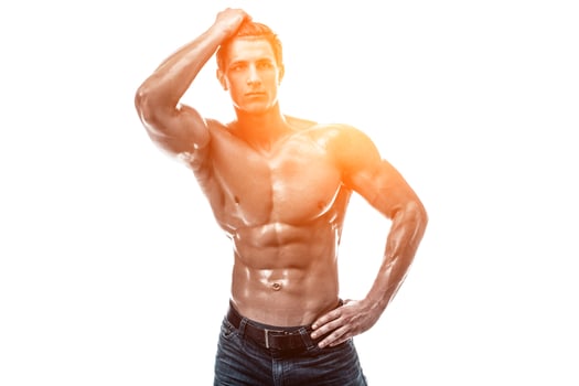 Muscular handsome young man with naked torso. Isolated on white photo