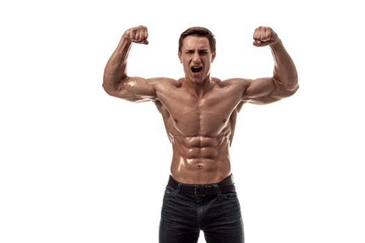 Muscular handsome young man with naked torso. Isolated on white background. photo