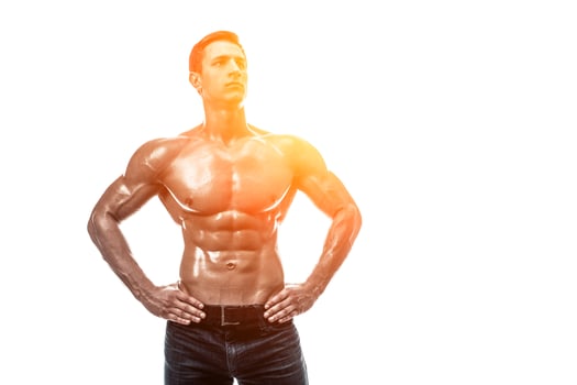 Muscular handsome young man with naked torso. Isolated on white photo