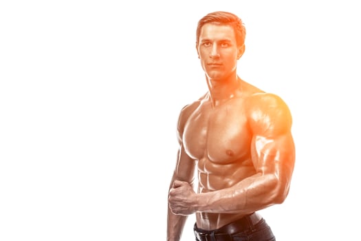 Muscular handsome young man with naked torso. Isolated on white photo