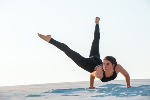 Young professional gymnast woman dance outdoor - sand beach photo