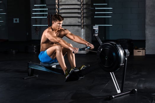 Muscular man doing exercise for legs in the gym photo