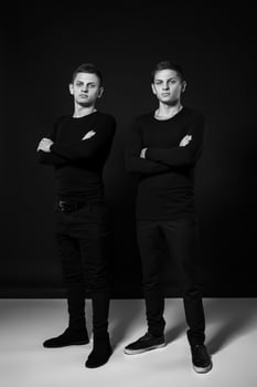 Casual twin brothers. Studio shot. Black and white photography photo