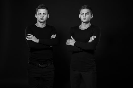 Casual twin brothers. Studio shot. Black and white photography photo