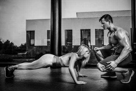 Sportive woman doing plank exercise training back and press musc photo