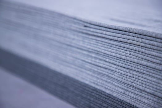 Stacked folded  Gray fabric Surface Texture Background Wallpaper. Selective Focus photo