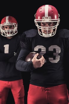 Football player on dark background photo