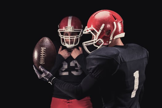 Football player on dark background photo
