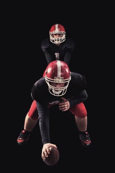 Football player on dark background photo