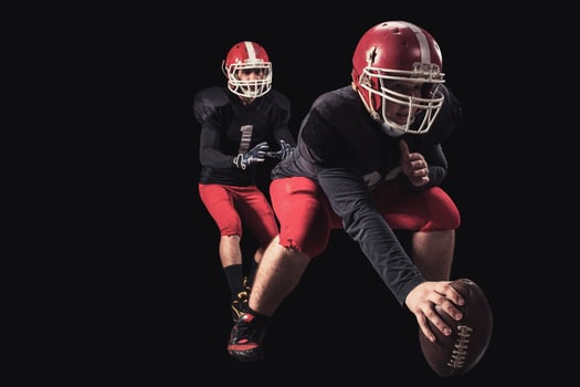 Football player on dark background photo