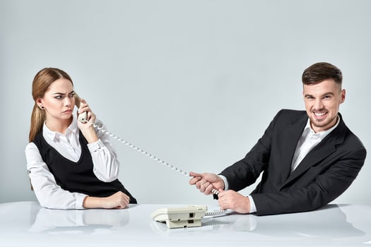 picture of man and woman with telephone at the table photo