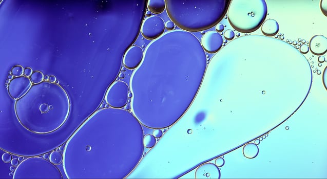 Abstract Colorful Food Oil Drops Bubbles and spheres Flowing on Water Surface photo