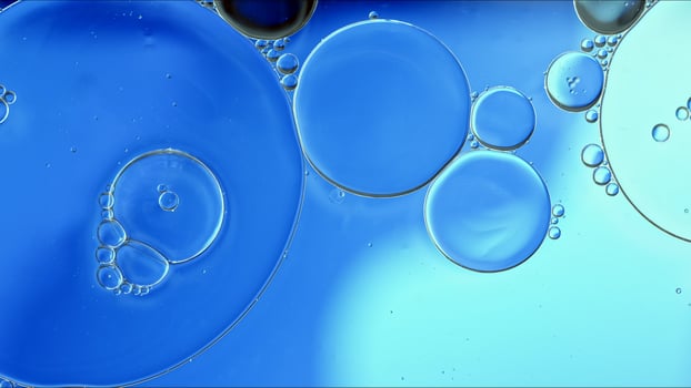 Abstract Colorful Food Oil Drops Bubbles and spheres Flowing on Water Surface photo