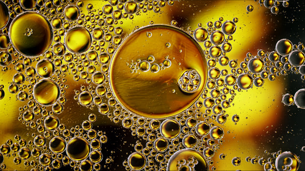 Abstract Colorful Food Oil Drops Bubbles and spheres Flowing on Water Surface photo