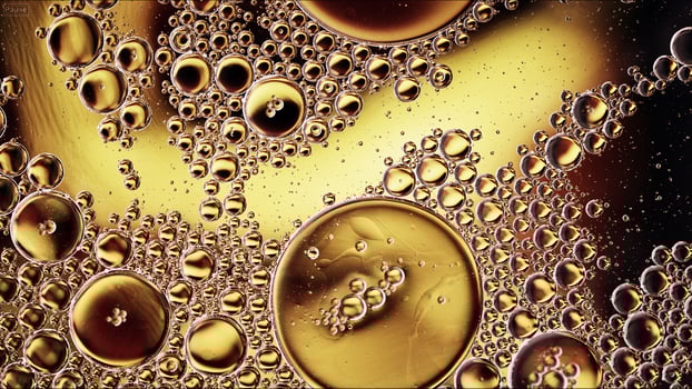 Abstract Colorful Food Oil Drops Bubbles and spheres Flowing on Water Surface photo
