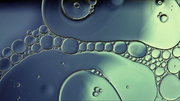 Abstract Colorful Food Oil Drops Bubbles and spheres Flowing on Water Surface photo
