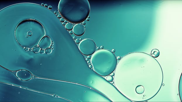 Abstract Colorful Food Oil Drops Bubbles and spheres Flowing on Water Surface photo