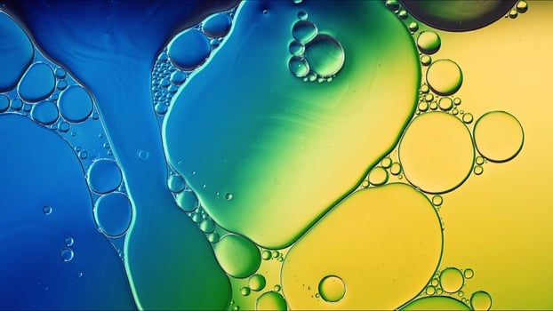 Abstract Colorful Food Oil Drops Bubbles and spheres Flowing on Water Surface photo
