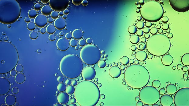 Abstract Colorful Food Oil Drops Bubbles and spheres Flowing on Water Surface photo