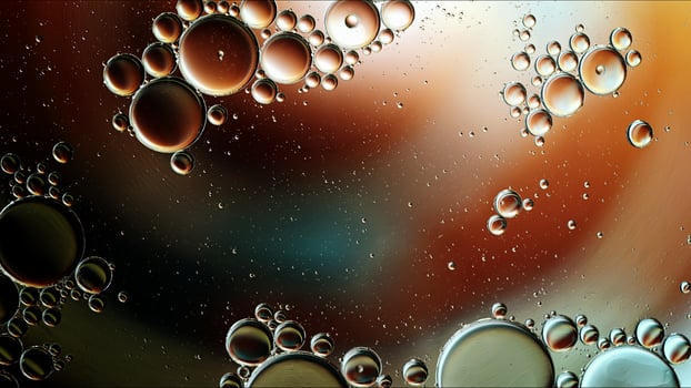 Abstract Colorful Food Oil Drops Bubbles and spheres Flowing on Water Surface photo