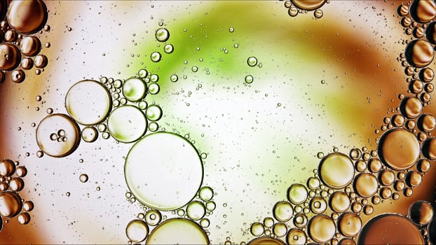 Abstract Colorful Food Oil Drops Bubbles and spheres Flowing on Water Surface photo