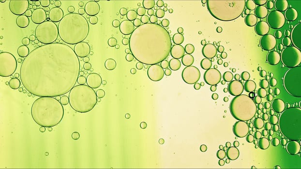 Abstract Colorful Food Oil Drops Bubbles and spheres Flowing on Water Surface photo