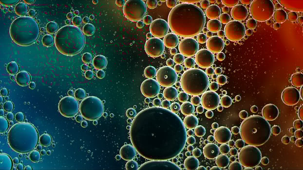 Abstract Colorful Food Oil Drops Bubbles and spheres Flowing on Water Surface photo