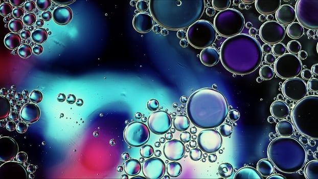 Abstract Colorful Food Oil Drops Bubbles and spheres Flowing on Water Surface photo