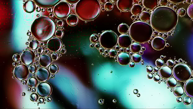 Abstract Colorful Food Oil Drops Bubbles and spheres Flowing on Water Surface photo