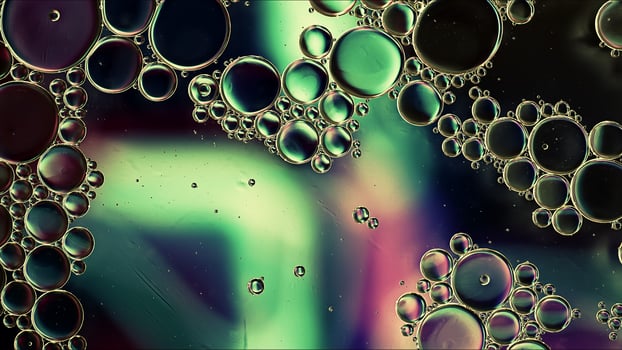 Abstract Colorful Food Oil Drops Bubbles and spheres Flowing on Water Surface photo