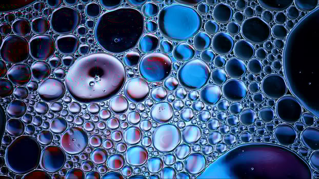 Abstract Colorful Food Oil Drops Bubbles and spheres Flowing on Water Surface photo