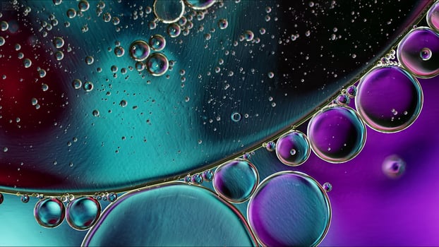 Abstract Colorful Food Oil Drops Bubbles and spheres Flowing on Water Surface photo
