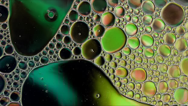 Abstract Colorful Food Oil Drops Bubbles and spheres Flowing on Water Surface photo