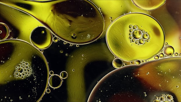 Abstract Colorful Food Oil Drops Bubbles and spheres Flowing on Water Surface photo