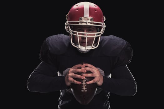 Football player on dark background photo