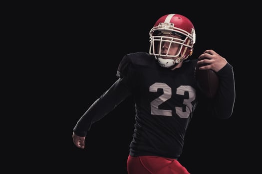 Football player on dark background photo