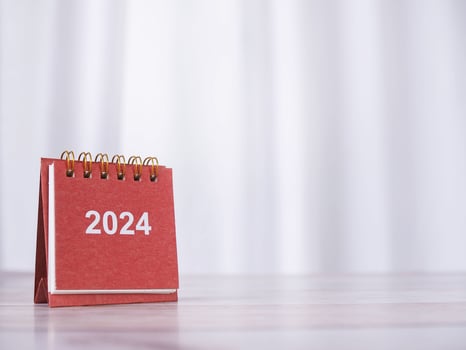 Close up 2024 desk calendar on the table with copy space. Resolution, Goal, Action, Planning, and manage to success business. photo