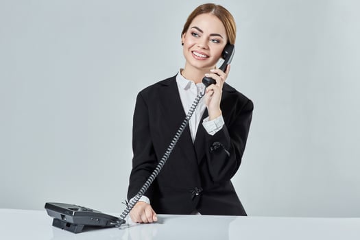 Portrait of young woman sitting at the table and working. photo