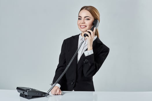 Portrait of young woman sitting at the table and working. photo