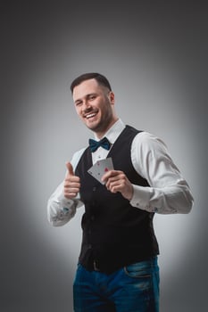Handsome poker player with two aces in his hands photo