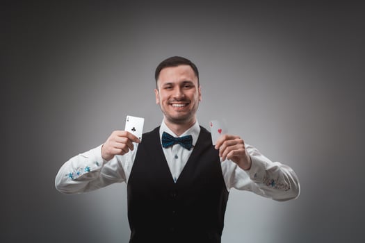 Handsome confident man holding cards looking at camera. photo