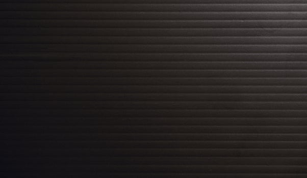 Seamless sheet wavy surface of black sponge foam as background. photo