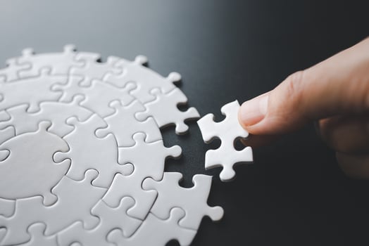 Closeup hand of woman connecting jigsaw puzzle, Business solutions, success and strategy concept photo