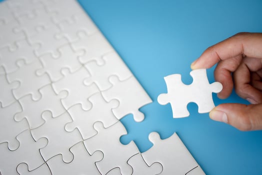 Closeup hand of woman connecting jigsaw puzzle, Business solutions, success and strategy concept photo
