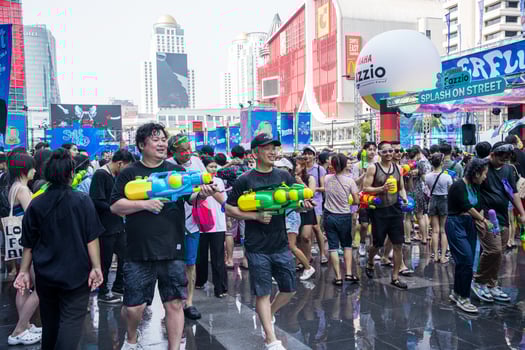 Siam Square, Bangkok, Thailand - APR 13, 2023 Songkran Festival, The short action of people joins celebrations of the Thai New Year or Songkran in Siam Square Bangkok, Thailand. photo