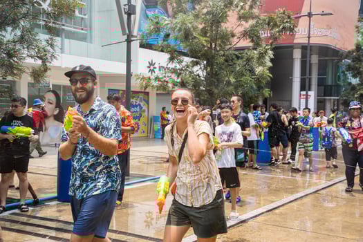 Siam Square, Bangkok, Thailand - APR 13, 2023 Songkran Festival, The short action of people joins celebrations of the Thai New Year or Songkran in Siam Square Bangkok, Thailand. photo