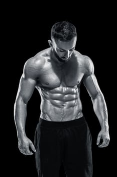 Muscular bodybuilder guy doing posing photo