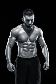 Muscular bodybuilder guy doing posing photo