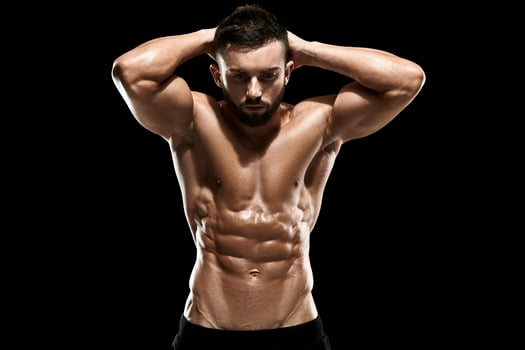 Muscular bodybuilder guy doing posing photo